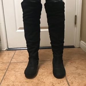 Wild Diva Lounge Black boots with fur top.